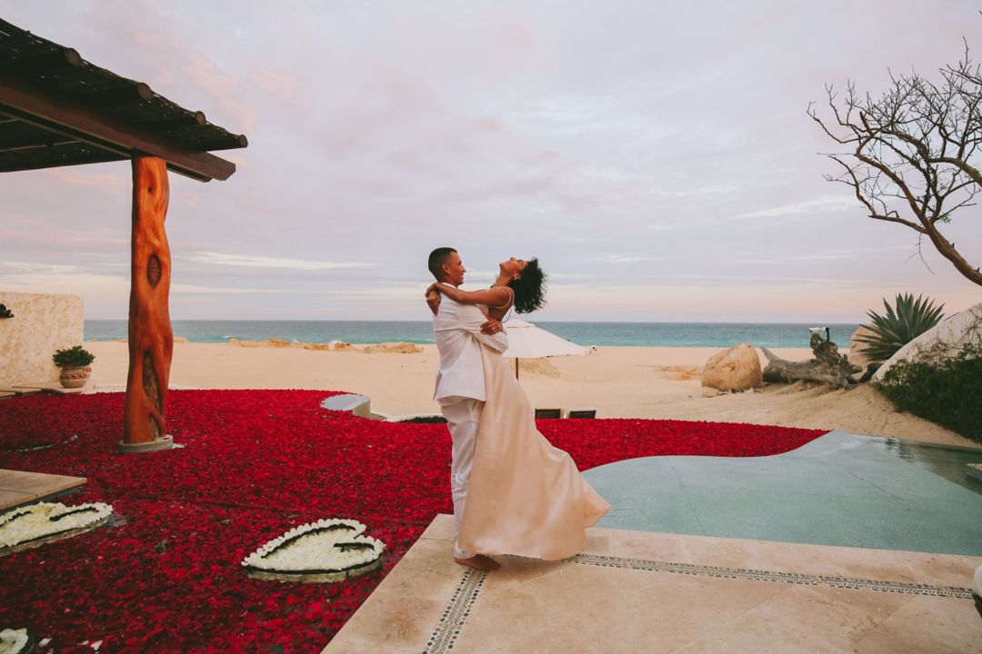 Couple by pool with roses